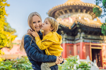 Wall Mural - Enjoying vacation in China. Mom and son in Forbidden City. Travel to China with kids concept. Visa free transit 72 hours, 144 hours in China