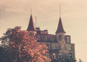 house with two towers, towers with spires, house in autumn