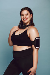 Wall Mural - Plus size young lady in sportswear