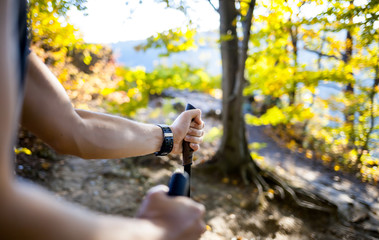 Wall Mural - man on trail holding trekking sticks
