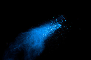 Wall Mural - Abstract blue powder splatted background. Colorful powder explosion on black background. Colored cloud. Colorful dust explode. Paint Holi.