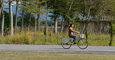 Sticker - Woman ride a bike in countryside