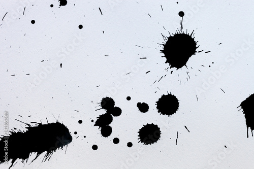 Fotografie, Obraz Black ink splashes on white textured paper for brushes and graphic design