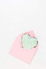 Valentine's Day background.  Letter on white background. Valentines day concept. Flat lay, top view, copy space.