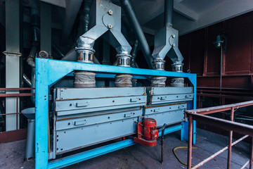 Wall Mural - Abandoned flour milling factory. Old rusty grain cleaning air separation machines 