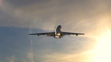 Large Passenger Airplane Taking Off Against Beautiful Sunset