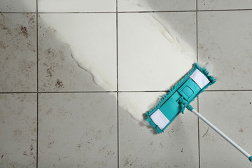 Sticker - Cleaning tile floor with mop, top view. Space for text