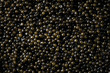 Black caviar background. High quality natural sturgeon caviar closeup. Delicatessen