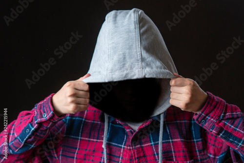 Fotografía faceless incognito man wear hood on dark background isolated b