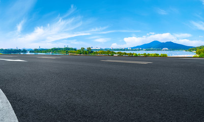 Empty asphalt road square and natural landscape under the blue sky