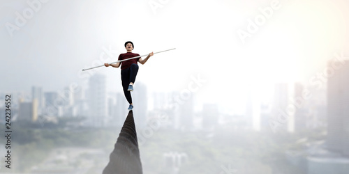 Fotografía Brave ropewalker on cable. Mixed media