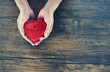 Give Love Man holding red Heart in hands for love Valentines day Donate  Help Give love warmth take care concept