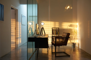 Soho office interior with sunset golden hour lighting and shadow , loft style interior design