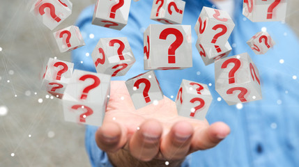 Leinwandbilder - Businessman using cubes with 3D rendering question marks