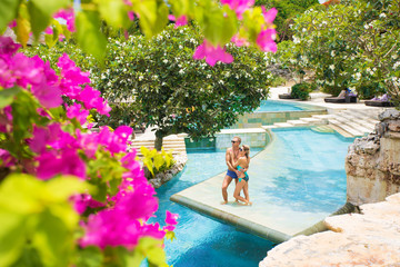 Wall Mural - Couple enjoying vacation in tropical resort