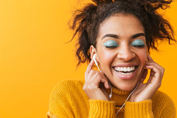 Poster - Cheerful african woman wearing sweater standing