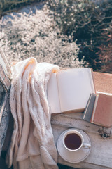 Poster - Book and coffee on window sill over spring tree