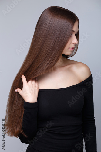 Beautiful Young Brunette Woman With Long Straight Hair And Healthy