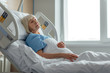 © LIGHTFIELD STUDIOS - selective focus of senior woman sleeping in hospital bed