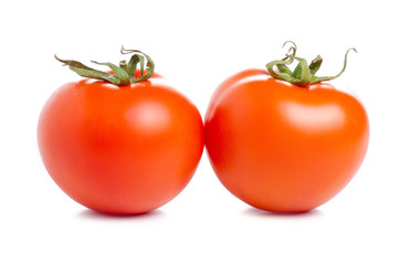 Wall Mural - Two tomatoes food on a white background. Isolation