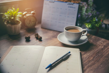 Wall Mural - appointment schedule concept. work from home, desktop calendar, diary place on office desk. notebook