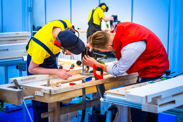 Poster - Men set up equipment. Carpentry production. A carpenter. Milling machine for wood. Milling machine.