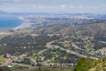 Wall Mural - Aerial view of Pacifica and San Pedro Valley as seen from Montara mountain, San Francisco and Marin County in the background, California