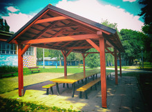 Picnic Shelters In A Beautiful Park, Blurred Image.