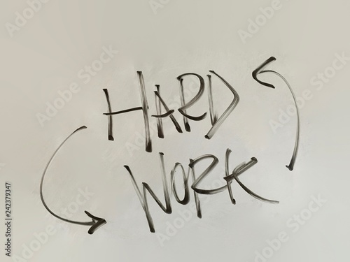 Fotografia hard work with arrows handwriting