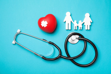  Flat lay composition with red heart and stethoscope on color background. Cardiology concept