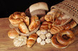 A variety of pastries on a wooden table on a black background