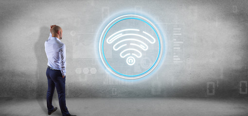 Poster - Businessman in front of a wall with Wifi icon with stats and binary code 3d rendering