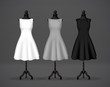 Women's black, gray and white basic dress mockup on mannequin. Festive dress without sleeves and long pleated skirt.