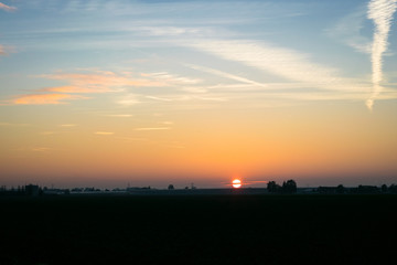 Wall Mural - the sun sets over the dutch countryside. photograph was taken on an autumn day in the green heart of