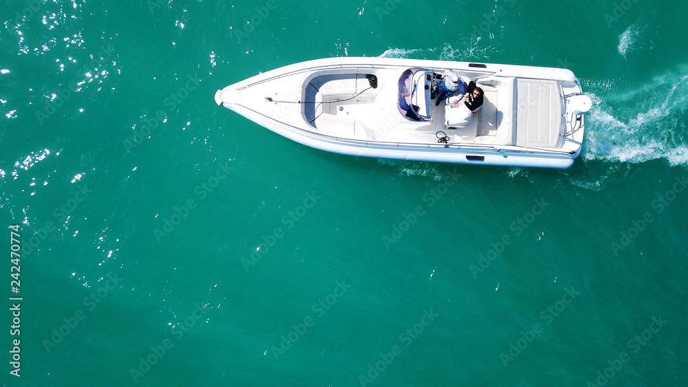 Aerial bird's eye top view photo taken by drone of boat docked in caribbean tropical beach with turquoise - sapphire waters - obrazy, fototapety, plakaty 