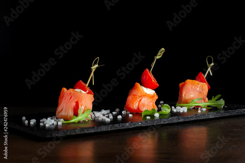 Cuadros en Lienzo Finger food. Rolls of salmon with cream cheese.