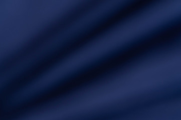 soft blurred mysterious dark blue fabric texture background