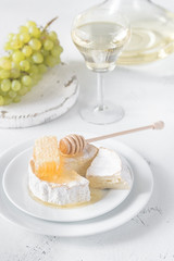 Canvas Print - Camembert with honey, grapes and white wine