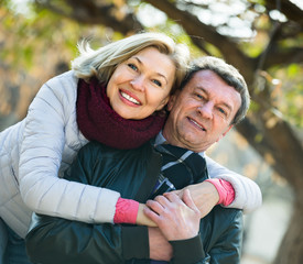 Wall Mural - Portrait of mature couple in park .