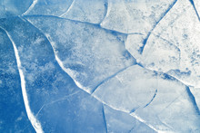 Abstract Ice Background.  Blue Background With Cracks On The Ice Surface