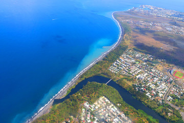 Aerial view to coral reef near Saint Paul village on Reunion Island.