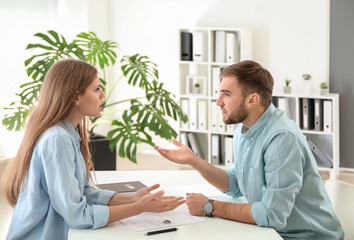 Sticker - Young emotional couple visiting divorce lawyer in office