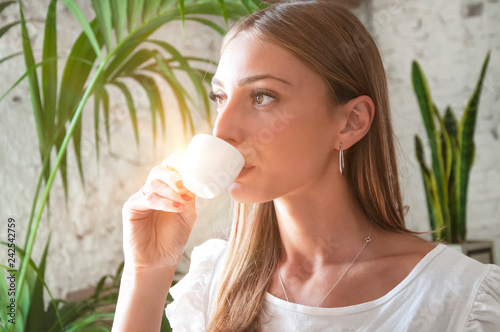 Fotografie, Obraz Young beautiful woman drinking espresso coffee