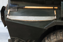 Saw And Shovel Mounted On Military Car