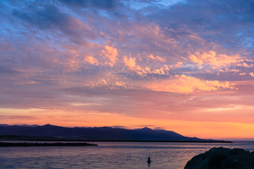 Wall Mural - Sunset sky covering Morro bay; Montana de Oro State Park in the background, California