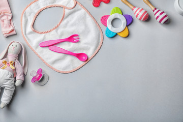 Wall Mural - flat lay composition with baby accessories and toys on gray background. space for text