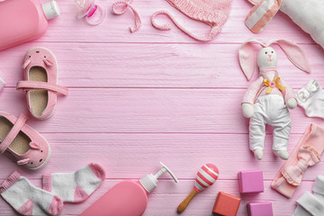 Wall Mural - flat lay composition with baby accessories and toys on color wooden background. space for text