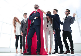 Wall Mural - boss is a superhero and the business team is standing together