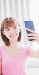 Wall Mural - young woman take a selfie