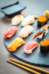 Poster - Nigiri sushi set with salmon tuna shrimp prawn eel shell and other sashimi